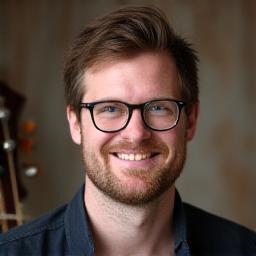 Headshot of Sam Jones, guitar and bass instructor